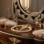 Pair of white pearl necklaces laid on a vintage art deco vanity table with mirror and perfume bottles