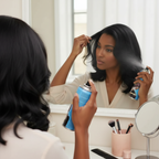 Person applying Party Success black temporary hair colour spray - easy application for instant transformation