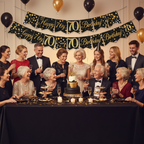 70th birthday party celebration with Sparkling Fizz banner displayed above party table with guests