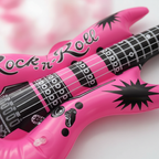 Extreme close-up macro of neon pink inflatable guitar showing glossy PVC texture and Rock n Roll graphics