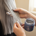 Hands applying La Riche Directions Silver hair dye from tub to silver hair strands, candid moment