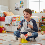 Boy laughing at Funny Boy Bubble Farting Machine blowing bubbles in bedroom - lifestyle image
