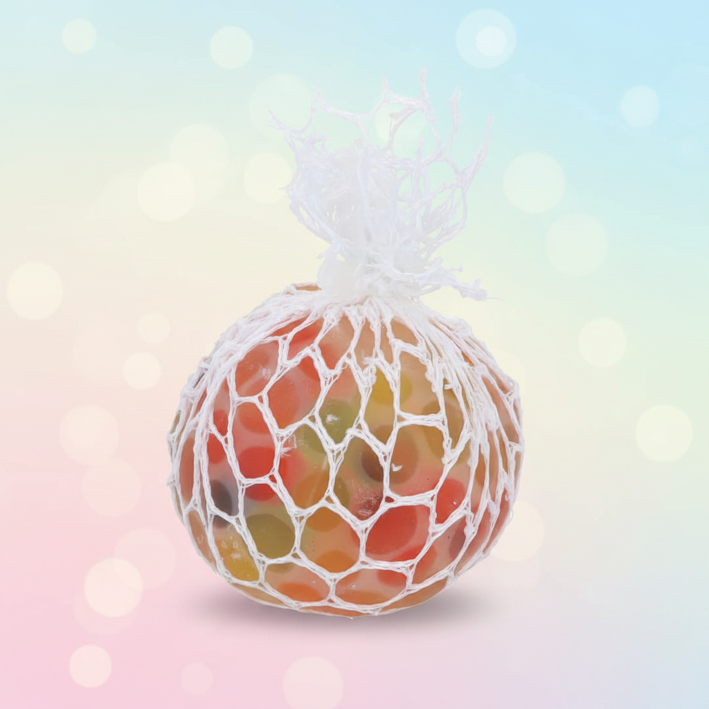 Squishy mesh net bead squeeze ball with orange red and yellow beads on pastel background
