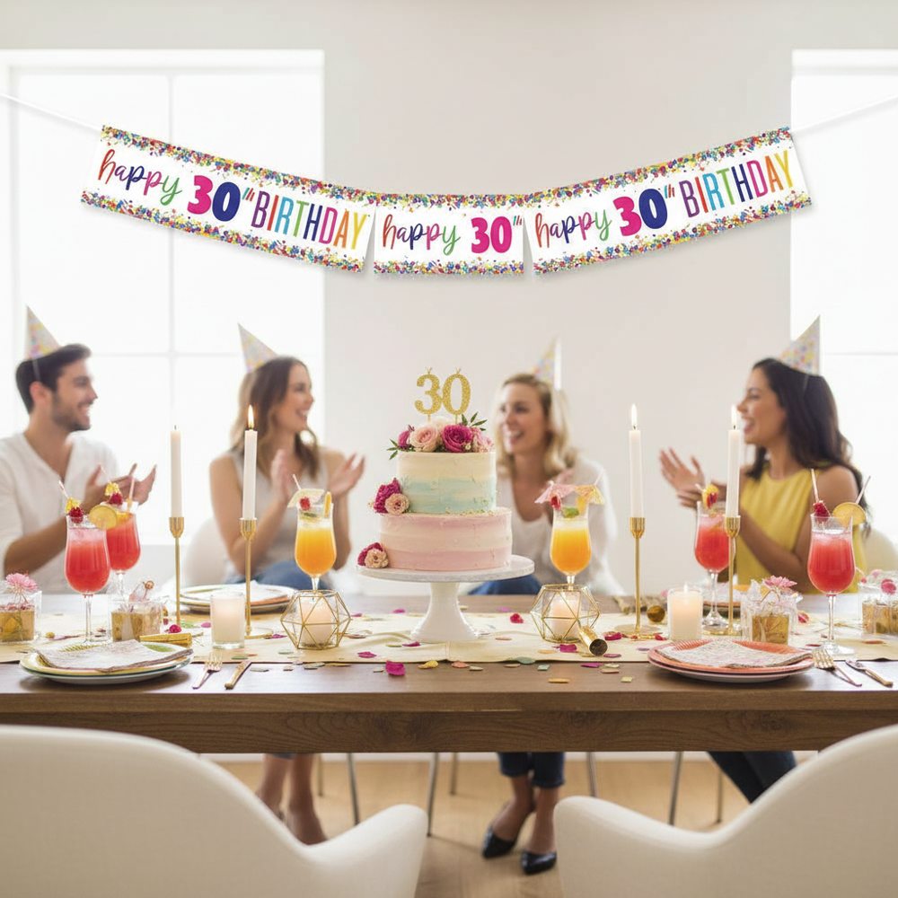 Stylish 30th birthday party table setup with multi-coloured confetti foil banner displayed above