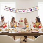 Stylish 30th birthday party table setup with multi-coloured confetti foil banner displayed above