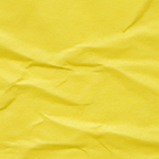 Extreme macro close-up of yellow tissue paper texture showing soft fibrous quality and translucency