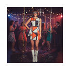 Woman wearing sleek rich brown bob wig as part of a complete 60s mod diva fancy dress costume