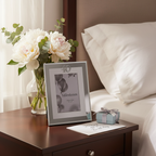 Milestones silver 40th birthday photo frame displayed on bedside table with flowers