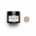 Leichner Camera Clear Foundation Porcelain jar beside a British pound coin on white background showing product size