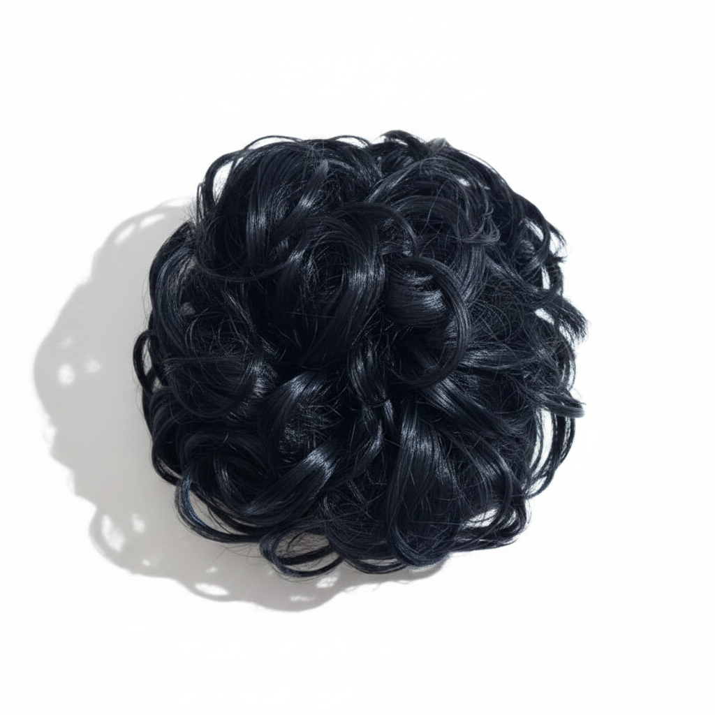 Extreme macro close-up of jet black curly hair bun showing individual curl texture, glossy sheen and strand craftsmanship detail