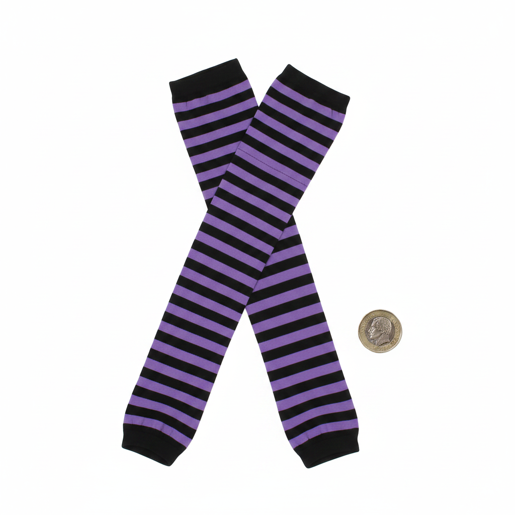 Flat lay of womens purple and black striped tights beside a British pound coin to show scale on white background