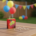 Cube Fun Throw Downs single box on wooden garden table at a children's birthday party with balloons in soft background