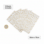 Gold star tissue paper 5 sheets fanned out beside a £1 coin showing 50cm x 75cm size, white background flat lay