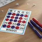 Completed bingo card with bold navy-purple and burgundy-red dab marks from Anker Stationery Bingo Markers Pack of 4
