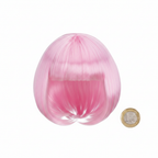 Baby pink bob wig flat lay beside £1 coin showing size on white background