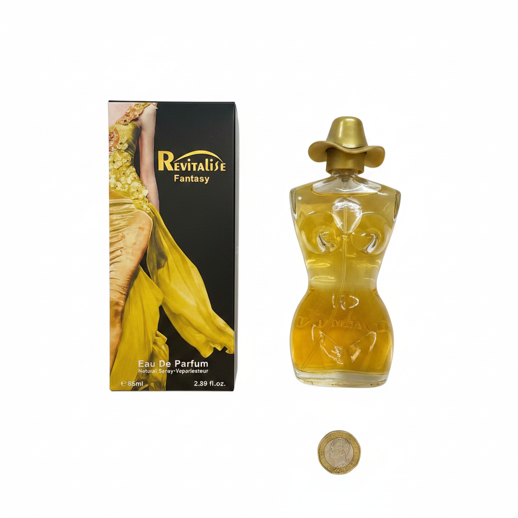 Revitalise Fantasy EDP 85ml bottle and box flat lay on white background with pound coin for scale