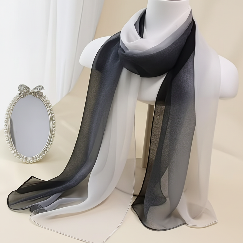 Lightweight black and white gradient chiffon scarf elegantly draped on clean white background