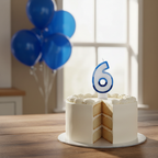 Blue number 6 birthday candle standing on a birthday cake in a kitchen setting with natural window light