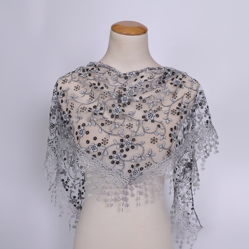 Womens grey triangle lace scarf displayed on a clean neutral studio background showing full lace detail and triangular silhouette