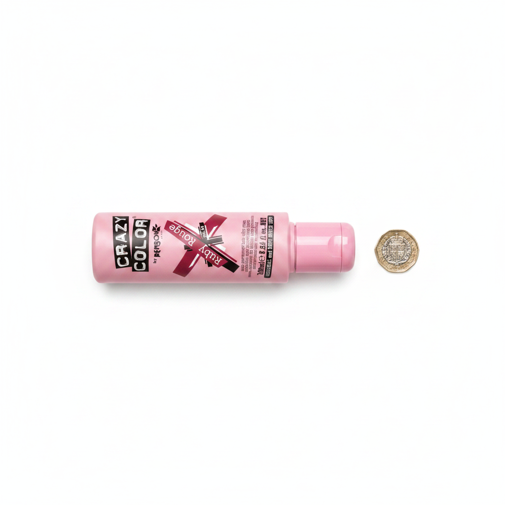 Crazy Color Ruby Rouge 100ml hair dye bottle beside a £1 coin on white background showing product size