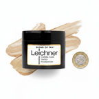 Leichner Camera Clear Tinted Foundation Blend of Tan flat lay beside a £1 coin showing product size
