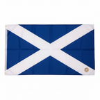 Scotland flag laid flat beside a UK £1 coin on white background to show scale, demonstrating the large 150 x 90cm size