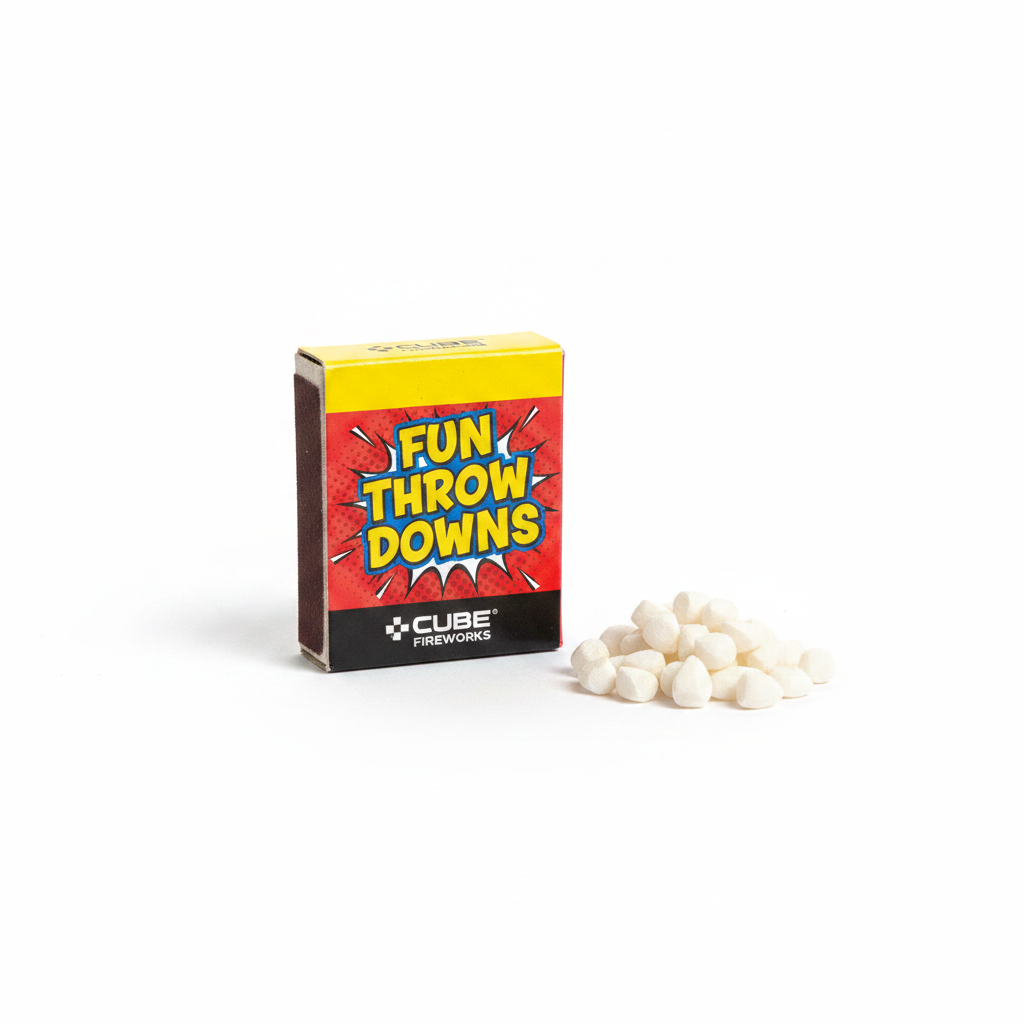Single box of Cube Fun Throw Downs fun snaps — vivid red box with yellow top strip and white paper snap bangs on white studio background