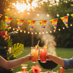 Flamingo Hawaiian Party Bunting 6m draped over an outdoor barbecue setting at golden hour with fairy lights