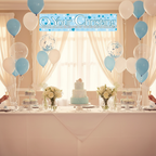 Elegant christening party table setup with 9ft blue holographic banner wall decoration