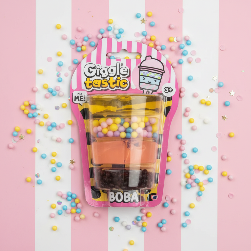 Giggletastic Boba-Themed Slime Stack Toy product shot on vibrant pink and white striped background with scattered boba pearls and confetti