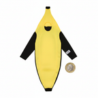 Barmy Banana Adults Fancy Dress Costume laid flat beside a British pound coin to show scale, on a pure white background