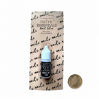 Technic Essentials Nail Glue 2ml flat lay beside £1 coin for scale on white background
