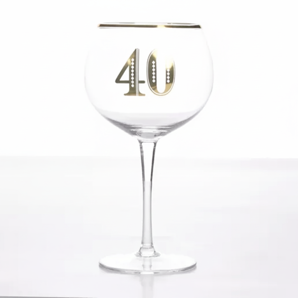 Art Deco 40th Birthday Gin Glass on pure white background, clear balloon gin glass with gold rim band and bold gold 40 numeral, Amazon hero shot