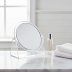 Clear Double Sided Mirror With Stand on White Marble Bathroom Shelf with Natural Light
