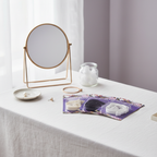 Three Adorn Adjustable Bra Strap packs arranged on a white linen dressing table with natural window light — interior lifestyle photography