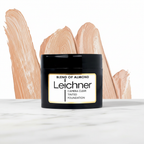 Leichner Camera Clear Foundation Blend Of Almond on white marble surface - professional product shot