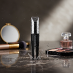 Lilyz Waterproof Volume Mascara Black with water droplets on luxury counter