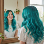 Woman admiring her vibrant turquoise hair in a mirror, showing the beautiful result of La Riche Directions Turquoise hair dye