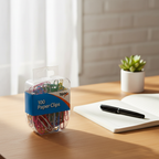 Tiger Stationery 100pcs assorted colour paper clips box on a tidy home office desk beside a notebook, pen and plant in natural window light