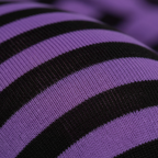 Extreme macro close-up of purple and black striped tights fabric showing knit texture and material quality
