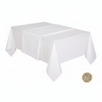 White plastic tablecloth flat lay beside a £1 coin on white background to show scale — 1.37M x 2.74M size