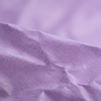 Extreme macro close-up of purple tissue paper showing delicate fibrous texture and soft translucent quality