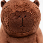 Extreme macro close-up of Cuddly Capybara plush toy fur texture showing soft brown plush material quality
