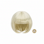 Diva blonde bob wig beside a £1 coin on white background showing product size — flat lay