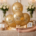 Hands arranging inflated gold sparkling fizz Happy Birthday balloons at chic birthday party venue