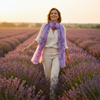 Woman wearing purple chiffon leaf print scarf walking through lavender field at golden hour - lifestyle fashion photo