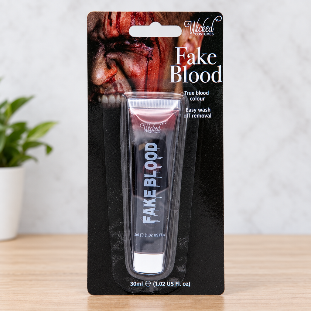 Close view of Wicked Costumes fake blood tube inside black retail blister packaging