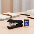Easy grip heavy duty stapler on a styled modern office desk, premium product shot