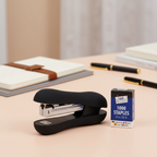 Easy grip heavy duty stapler on a styled modern office desk, premium product shot