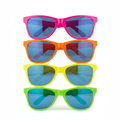 Giant plastic clown neon glasses in assorted colours — hot pink, orange, yellow and green — on white background